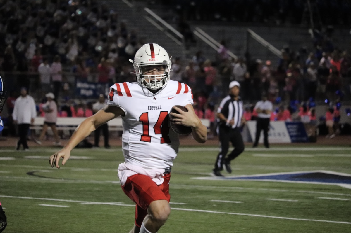 Coppell+quarterback+junior+Edward+Griffin+carries+for+a+first+down+in+the+first+quarter+against+Hebron+at+Brian+Brazil+Stadium+on+Friday.+The+Cowboys+defeated+the+Hawks%2C+49-0.+Ainsley+Dwyer.